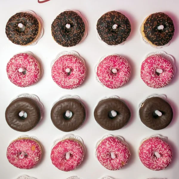 A yummy pink donut wall.